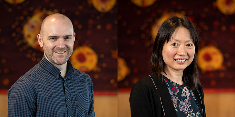 Andrew Webb and Cherie Chiang photographed in front of a colourful tapestry