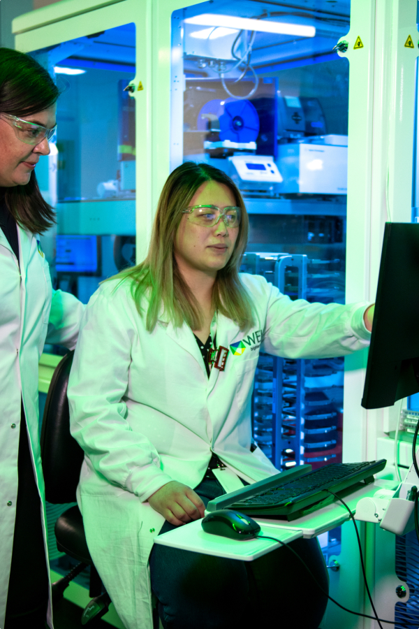 WEHI researchers with scientific equipment