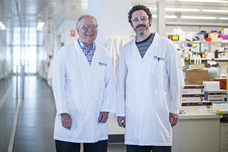 Two researchers standing in a laboratory