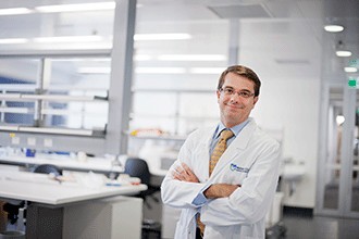 Professor Andrew Roberts standing in a lab