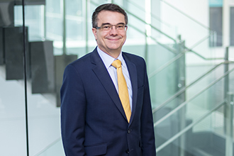 Scientist standing smiling at camera