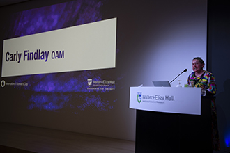 Carly Findlay OAM delivering an International Women's Day address