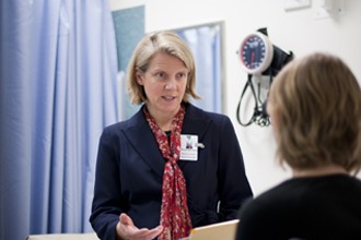 Associate Professor Clare Scott talking to a patient