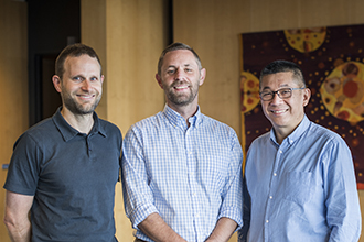 Researchers smiling