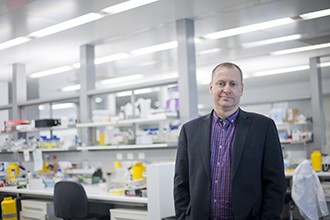 Professor Doug Hilton standing in a laboratory