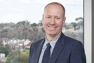 Professor Doug Hilton standing