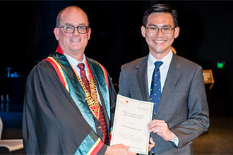 Dr Edward Chew receiving award