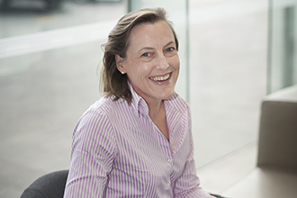 Professor Gabrielle Belz in chair smiling