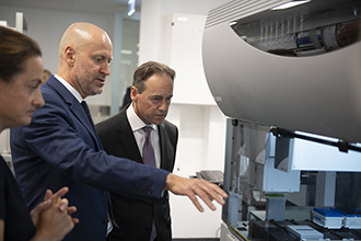 Greg Hunt MP is shown robotic equipment