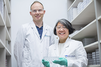 Two researchers standing together