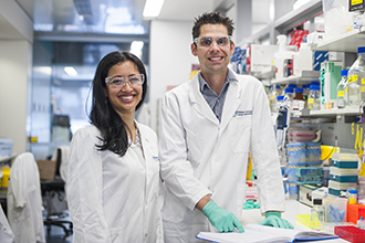 Two scientists standing in a lab