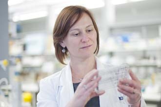 Dr Krystal Evans holding a protein screen