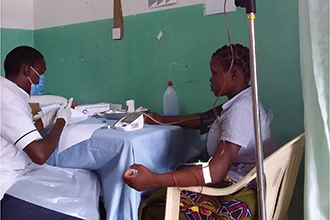 Woman with intravenous drip in a medical clinic