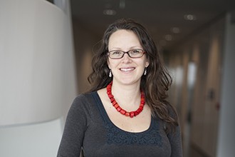 Dr Marnie Blewitt standing in a corridor