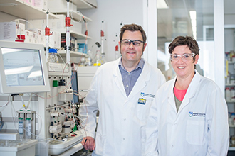 Scientists James Murphy and Isabelle Lucet standing in a laboratory