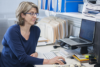 Dr Ruth Kluck in her office at the computer