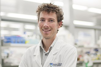 Photograph of a researcher smiling at camera