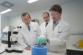 Mr Tony Abbott, Mr Peter Dutton and Dr Peter Czabotar in a laboratory