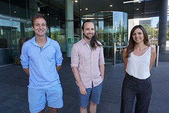 Three researchers photographed outside WEHI