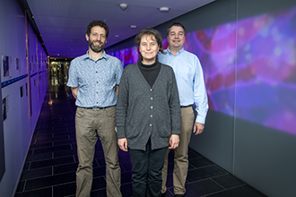 Three researchers photographed in WEHI's galleria