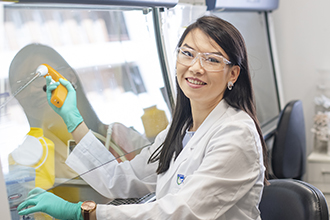 Researcher smiling in the lab