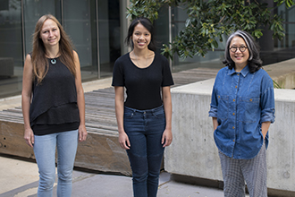 Three scientists standing outside WEHI