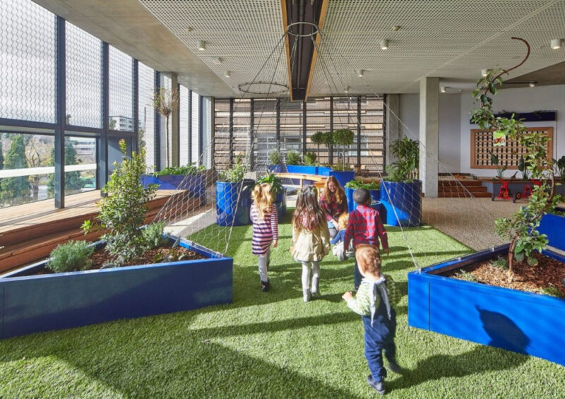 Children playing in an indoor garden at Froebel Melbourne Parkville centre