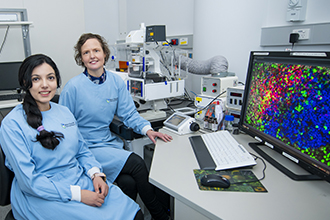 Researchers with microscopy