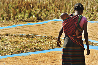 Woman carrying baby