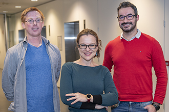 Researchers smiling