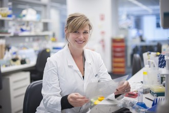 Dr Emma Stuart looking at gel photo