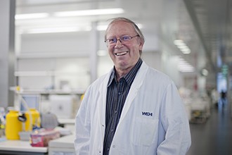 Professor Jerry Adams standing in a lab