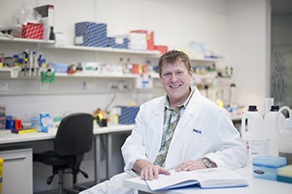 Dr Lukasz Kedzierski at lab desk