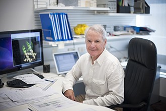 Peter Colman at desk