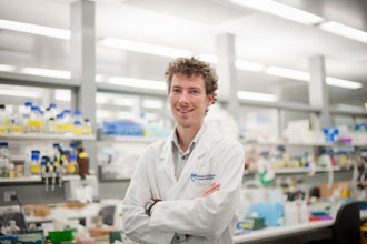 Seth Masters standing in a lab