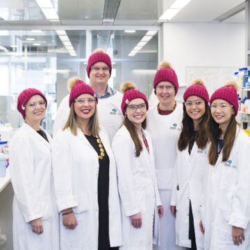Brain Cancer Centre team wearing beanies in the lab