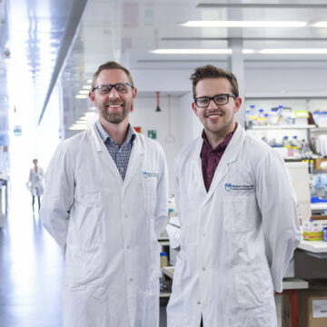 Two researchers from the Parkinson's Disease Research Centre standing in a laboratory