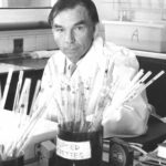 Ian Mackay at his desk 1956