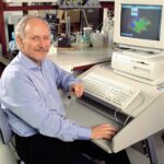 Len Harrison shows a molecular model of insulin on his computer