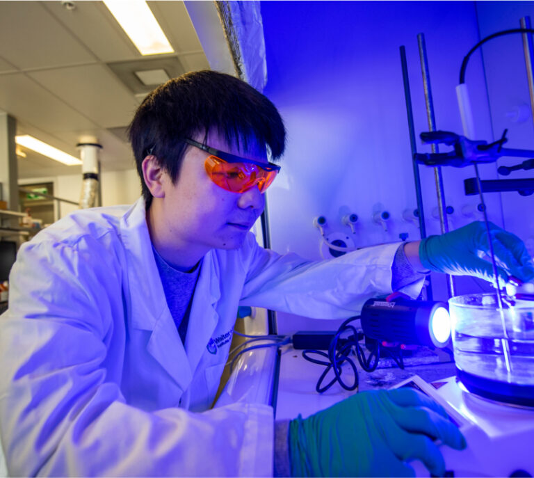 Resarcher in blue light