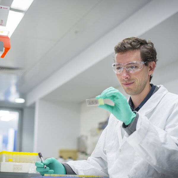 Seth Masters photographed working in a laboratory