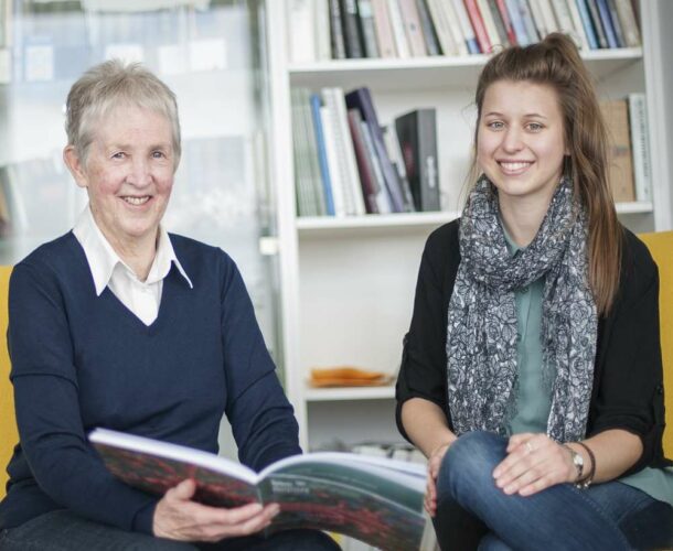 Paline Speedy and Gabrielle Mitchell reading a book