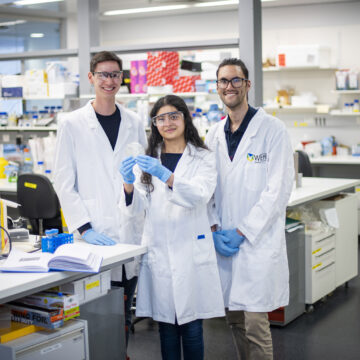 Three students in a laboratory
