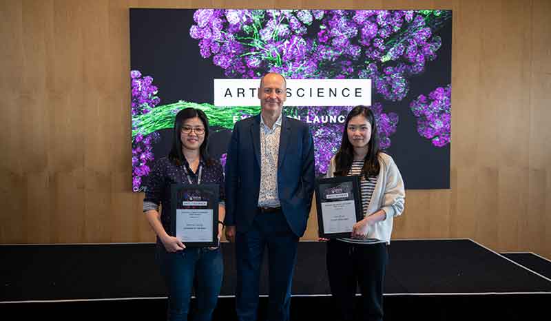 Professor Doug Hilton with first place getters Still images First place: Interweb of the mind by Melody Leong (left) Moving images First place: Thymic coral reef by Kelin Zhao (right)