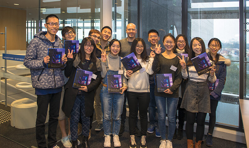 Group photo of Professor Doug Hilton with visiting students from Asian universities
