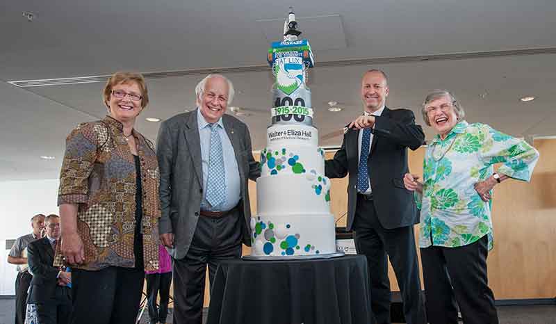 From left to right: Professor Suzanne Cory (past director), Sir Gustav Nossal (past director), Institute director Professor Doug Hilton and Elizabeth (Liz) Dexter, daughter of Sir Macfarlane Burnet cutting the Centenary Birthday Cake.
