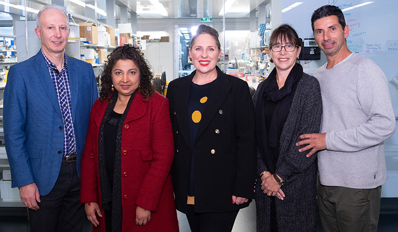 Parents of both Isabella and Marcus posing with Associate Professor Misty Jenkins (centre)