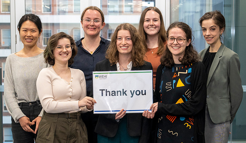 Group of students holding a thank you sign