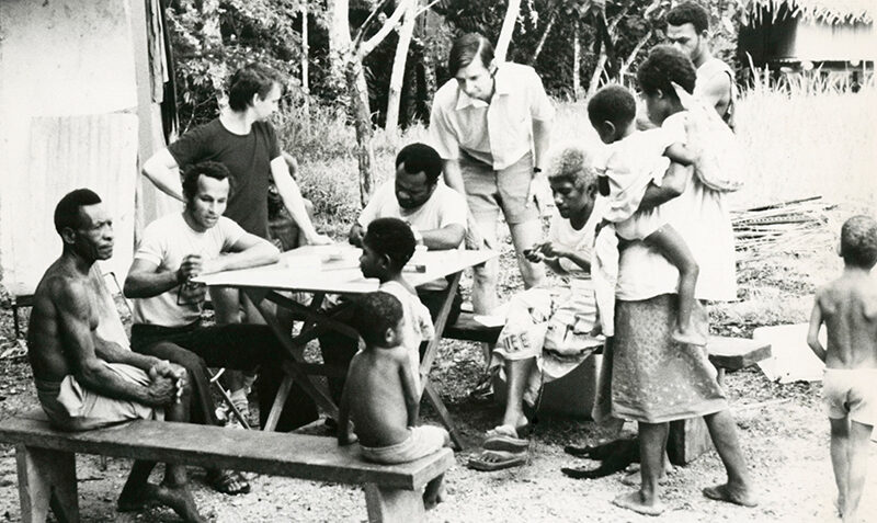 From bench to community: WEHI’s Graham Brown with locals in Papua New Guinea, in the 1980s.