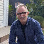 James photographed sitting in a garden